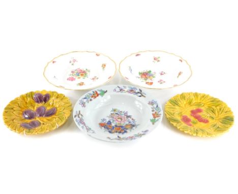 A collection of ceramics, to include a pair of German porcelain soup plates, each painted with flowers, on a moulded group wi