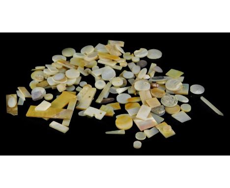 A collection of carved mother of pearl gaming counters, mainly small pieces.