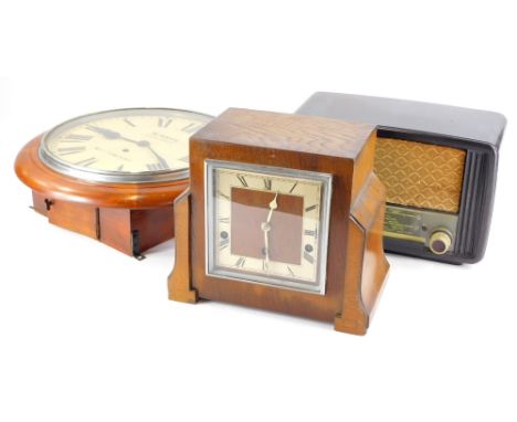 A stained pine wall clock, the painted dial stamped W. White Carlton Road, Nottingham, an Art Deco mantel clock in oak case, 