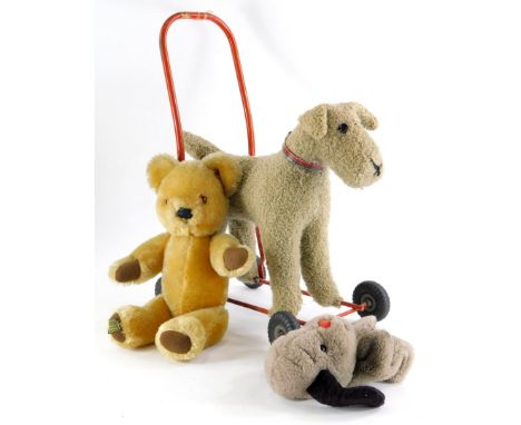 Three plush toys, to include a Tri-ang type push-a-long terrier, a Harrods bear and a Sweep puppet.