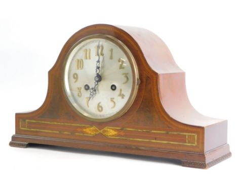 An Edwardian mahogany boxwood strung mantel clock, the silver dial with gilt Arabic numerals, on bracket feet, 42cm wide.