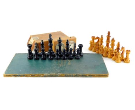 A Staunton pattern yew and ebonised chess set, a chess board and a timer clock.