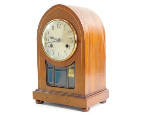 An Edwardian mahogany and boxwood strung lancet shaped mantel clock, with silver dial and leaded glass panel, 31cm high.