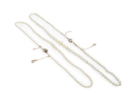 A natural saltwater pearl necklace composed of a single strand of natural saltwater pearls, to a box clasp set with nine half