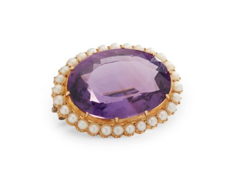 An amethyst and seed pearl brooch claw-set with an oval-cut amethyst, in a border of halved seed pearls, unmarked(Width: 2.7c