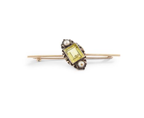 A yellow sapphire and pearl brooch millegrain-set with a rectangular step-cut yellow sapphire, flanked to either side by a ha