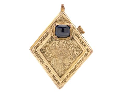 A copy of the Middleham Jewel gilt metal, engraved with a depiction of the crucifixion and collet-set with a blue cabochon pa