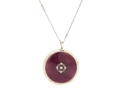 An early 20th-Century pearl and enamelled portrait pendant of circular outline, one side with purple guilloche enamel ground 
