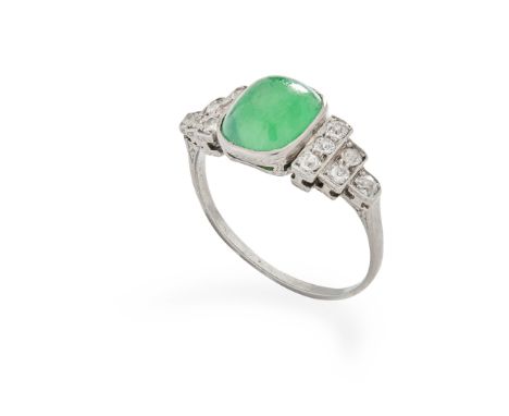 A 1930s jade and diamond ring collet-set with a cabochon jadeite, each shoulder set with six old round-cut diamonds, unmarked