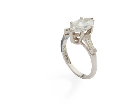 A single-stone diamond ring claw-set with a marquise-cut diamond, each shoulder set with a tapered baguette-cut diamond, stam