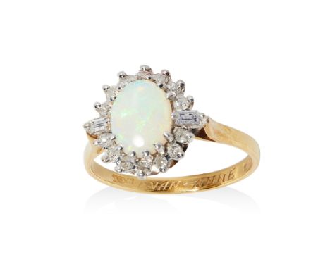 An opal and diamond cluster ring claw-set with a cabochon opal, in a single border of fourteen eight-cut and two baguette-cut