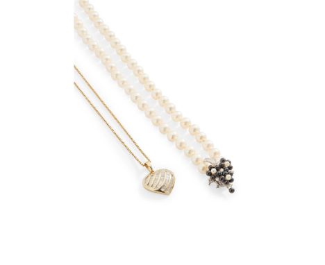 A pearl necklace composed of a single strand of cultured pearls, the clasp modelled as a foliate spray, set with small black 