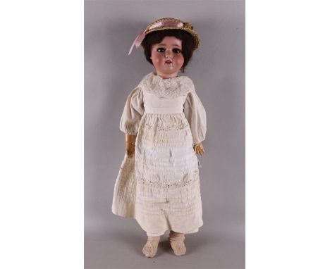 A porcelain doll with limbed body, Germany, Schoenau &amp; Hoffmeister, ca. 1920. Marked 'SPBH' no. 1909 - 7 1/2, weighted br