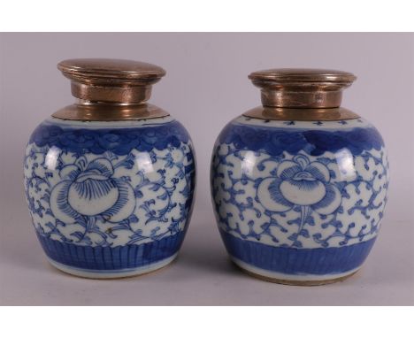 A pair of blue and white porcelain tea caddy/ginger jars with 2nd grade 835/1000 silver mountings of a later date, China, 19t