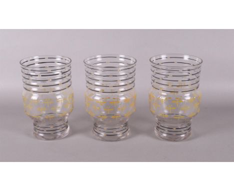 A series of three clear glass vases with enamel painted fantasy decoration, design: C.J.Lanooy, ca.1921. Execution: Glass Fac