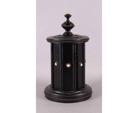 An ebony cigar mill with hinge mechanism, circa 1900, h 26 cm.