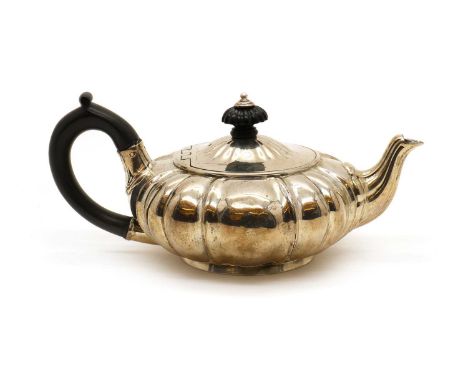 A George III silver teapot,by Robert Garrard II, London 1819, of squat form with ebony handle and finial,10cm high,16oztCondi