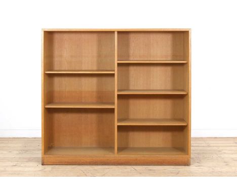 A light oak open bookcase, designed by Børge Mogensen for Karl Andersson &amp; Söner, with two divisions with two and three a