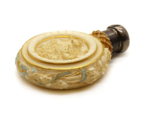 A Royal Worcester blush ivory porcelain Golden Jubilee scent bottle,c.1887, moulded with a bust of Queen Victoria, over a lig