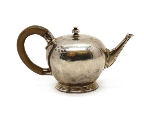 A small silver Queen Anne-style teapot,by Arthur Martin Parsons and Frank Herbert Parsons, London 1932, retailed by Tessiers 