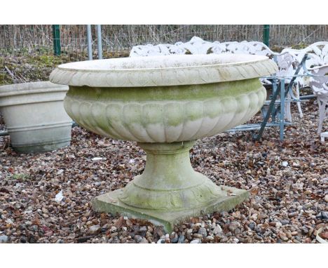 A large Haddonstone Clarence pattern urn,the gadroon moulded shallow bowl with lapit border, on a socle stand92cm diameter65m