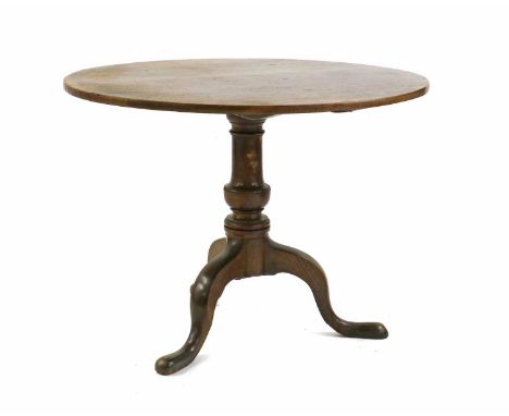 A George III oak tripod table,c.1800, with circular tilt top, 94.5cm diameter70cm highCondition ReportFaded polish top with a