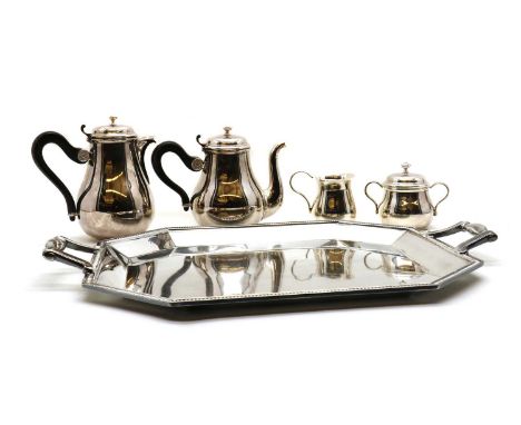 A silver plated Christofle tea service,mid 20th century, marked Christofle Paris, of bulbous form, the handle with a flower m