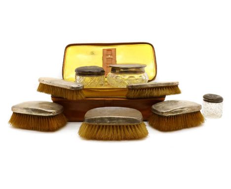 A silver-mounted dressing table set,by William Neale &amp; Sons Ltd, Birmingham 1929, comprising four brushes and a further a