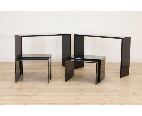 A pair of contemporary black Lucite console tables,110cm wide 31.5cm deep73cm high, together with two pairs of matching nests