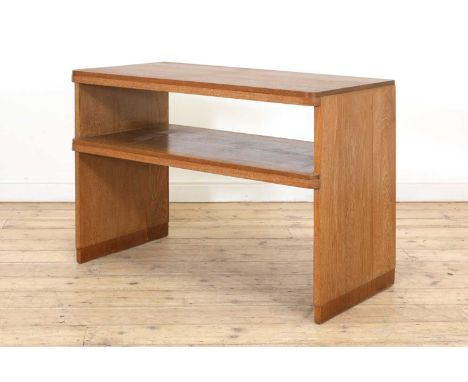 A limed oak console table, 1960s, in the manner of Gordon Russell, the rectangular top with rounded corners to the front, ove