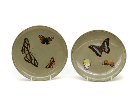 A pair of Minton Art Pottery plates,early 20th century, each with Pâte-sur-pâte decoration of butterflies, stamped to the und