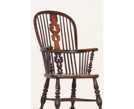 A Victorian yew and elm Windsor chair, second half of the 19th century, Yorkshire, with a high hoop back and a pierced fruitw