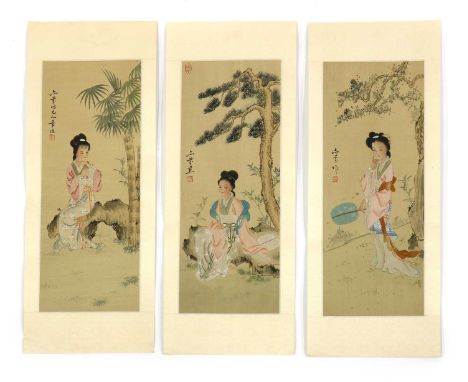 A group of three Chinese paintings,20th century, each painted with a lady under bamboo, pine or a blossoming tree, signed and