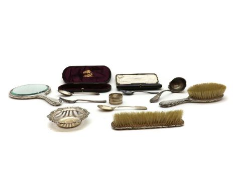 A group of silver items,to include a part dressing set by W G Sothers &amp; Co, Birmingham 1916, the mirror 27cm long, a case