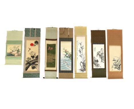 A collection of seven Chinese and Japanese hanging scrolls,20th century, each decorated with a mountainous landscape, bamboo 