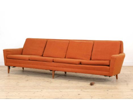 A Swedish four-seater settee,1960s, designed by Folke Ohlsson for Dux, with tapering sides, upholstered in orange wool fabric