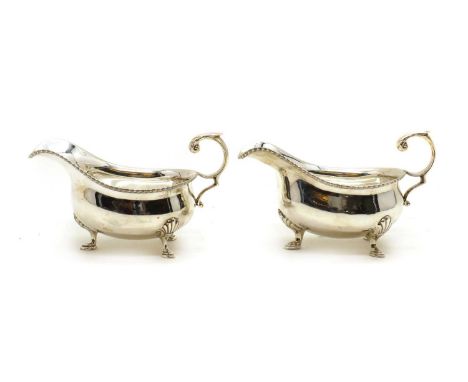 A pair of silver sauceboats,by Harrison Brothers and Howson, Sheffield 1944, 15cm wide9.5oztCondition ReportKnocks, scuffs an