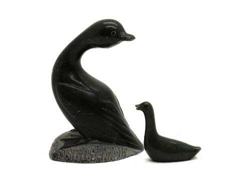 A Canadian Inuit hardstone carving, 1977, modelled as a loon, numbered to the underneath 579822, bearing a label inscribed 'C