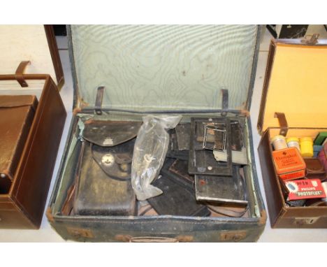 Old blue suitcase containing camera plates & plate camera