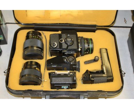 Bronica ETRS Camera, three lenses, spare film holder and motor drive in a case