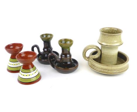 A Swedish studio pottery chamber stick, h. 16.5 cm, a pair of chamber sticks and a pair of candlesticks
