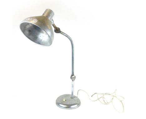 An industrial desk lamp, the steel body with an adjustable shade, h. 63 cm
 CONDITION REPORT: Heavy pitting and corrosion, wi