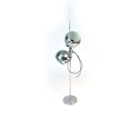 A 1970's chromed standard lamp, the two semi-spherical shades supported on a straight shaft
 CONDITION REPORT: Working order 