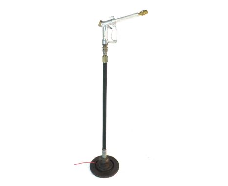 A standard lamp in the form of a petrol pump and hose
 CONDITION REPORT: Working order unknown