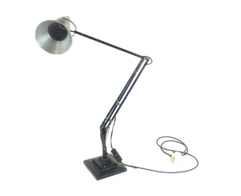 An early Angle-poise adjustable desk lamp by Herbert Terry, the steel shade on a black shaft
 CONDITION REPORT: Working order