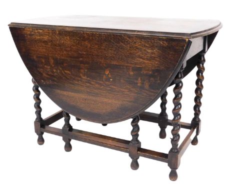 A 19thC oak gate leg dining table, raised on barleytwist supports united by a box stretcher, 73cm high, 106cm wide, 59cm deep