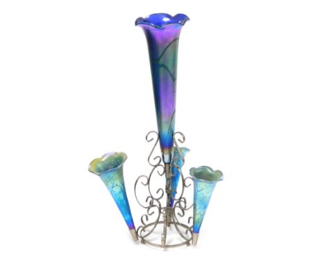 An Okra iridescent glass and silver plated four branch epergne, the trumpets with trailed decoration, signed by Richard P Gol