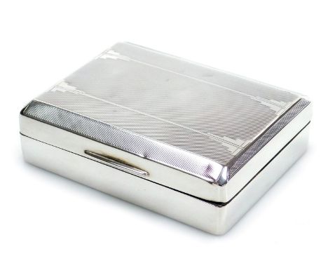 A George V silver cigarette box, with engine turned decorated top and a cedar interior, Birmingham 1931, 12cm x 9cm, 8.90oz a