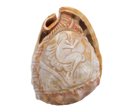 A Neapolitan conch shell cameo, carved with Cartha the goddess playing a harp, 12cm high.