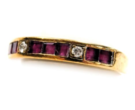 A 9ct gold, ruby and diamond half hoop eternity ring, set with seven square cut rubies, and two brilliant cut diamonds, in a 